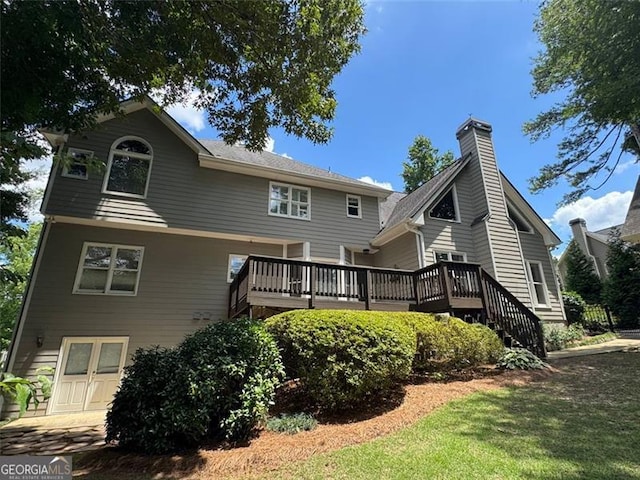 1464 Chatsworth Trce, Lawrenceville, GA 30044 - back of property featuring a wooden deck, a lawn, and a chimney