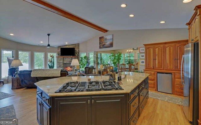 212 Windjammer Dr, Hiawassee, GA 30546 - kitchen with freestanding refrigerator, gas stovetop, light wood-type flooring, open floor plan, and recessed lighting