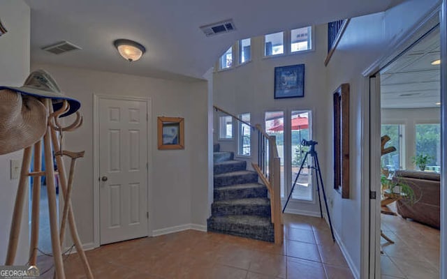 212 Windjammer Dr, Hiawassee, GA 30546 - tiled entryway featuring stairs and baseboards