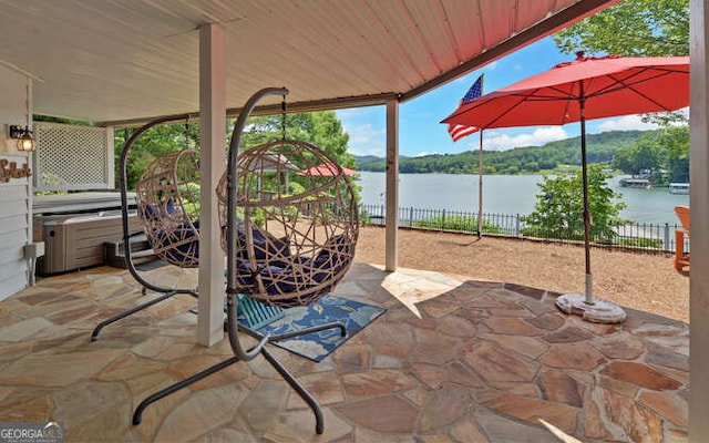 212 Windjammer Dr, Hiawassee, GA 30546 - view of patio featuring a hot tub and a water view