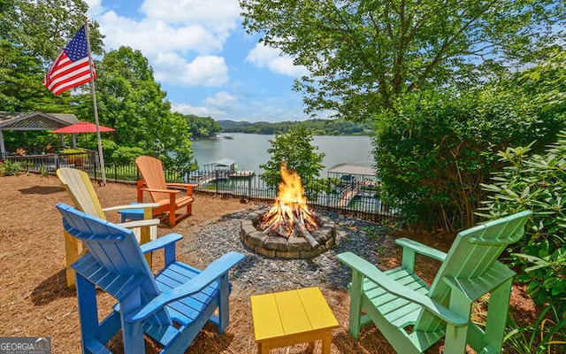 212 Windjammer Dr, Hiawassee, GA 30546 - view of patio with an outdoor fire pit and a water view