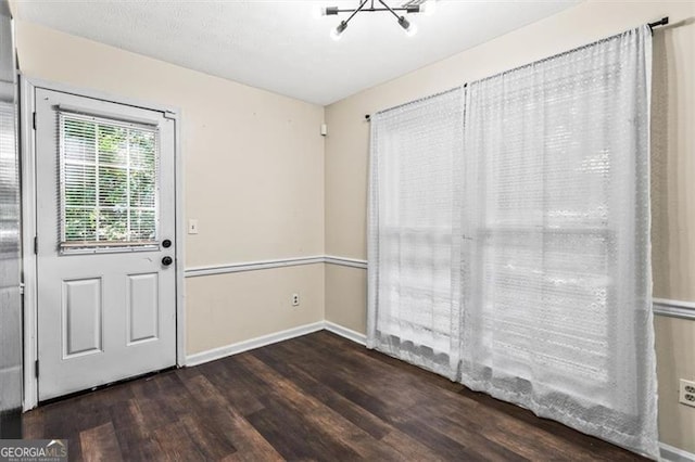 4146 Monclair, Columbus, GA 31907 - unfurnished dining area with wood finished floors and a chandelier
