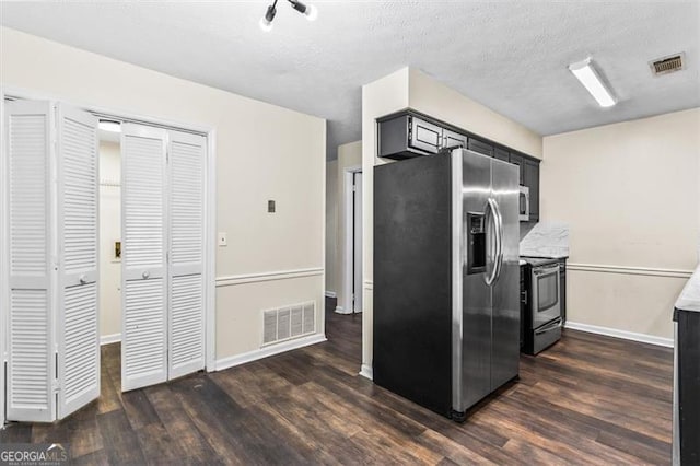 4146 Monclair, Columbus, GA 31907 - kitchen with stainless steel appliances, dark wood-style floors, dark cabinets, and light countertops