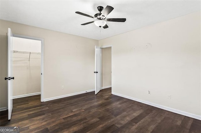 4146 Monclair, Columbus, GA 31907 - unfurnished bedroom featuring wood finished floors, a closet, a ceiling fan, and a walk in closet