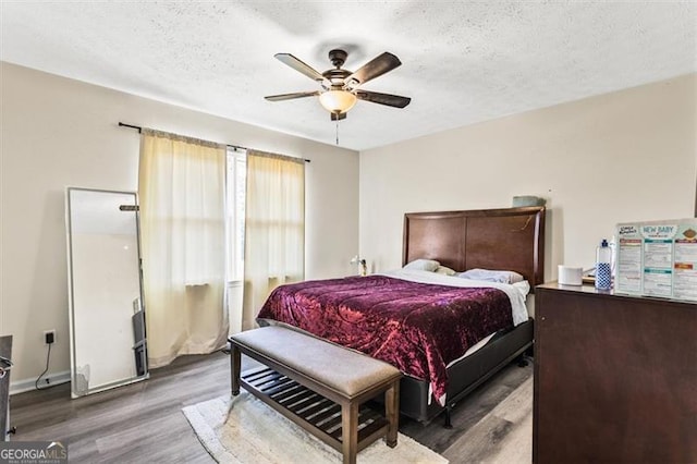4146 Monclair, Columbus, GA 31907 - bedroom featuring wood finished floors, a textured ceiling, and ceiling fan