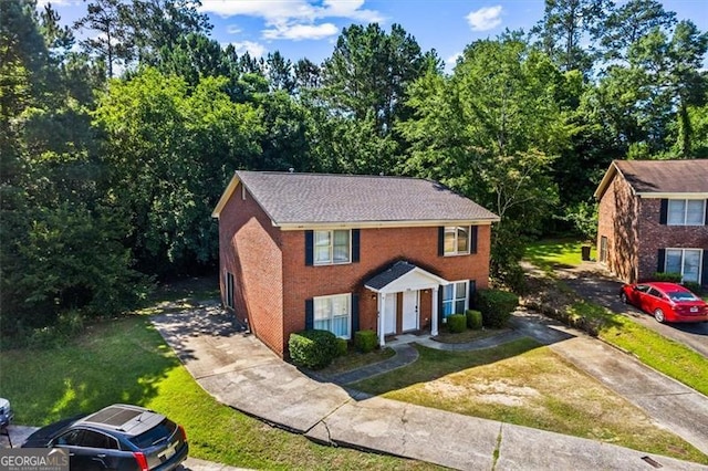 4146 Monclair, Columbus, GA 31907 - colonial home with driveway, a front yard, and brick siding