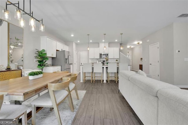 1969 Lanier Harbor Pt, Buford, GA 30518 - dining room with recessed lighting and light wood-style flooring
