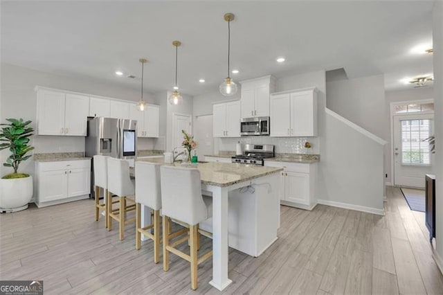 1969 Lanier Harbor Pt, Buford, GA 30518 - kitchen featuring appliances with stainless steel finishes, white cabinets, and recessed lighting