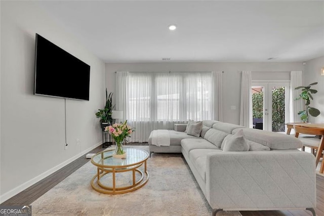1969 Lanier Harbor Pt, Buford, GA 30518 - living area with wood finished floors, recessed lighting, and french doors
