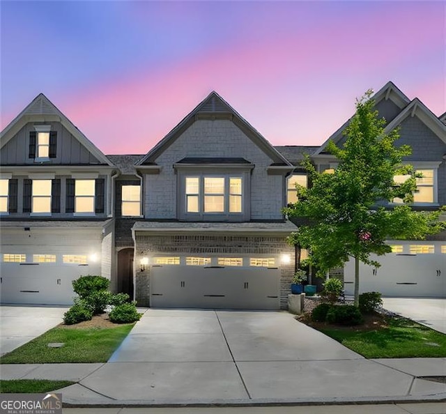 1969 Lanier Harbor Pt, Buford, GA 30518 - view of front of home with concrete driveway, a garage, and brick siding