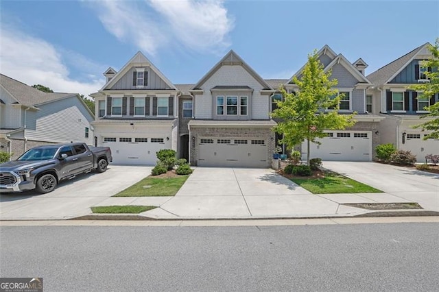 1969 Lanier Harbor Pt, Buford, GA 30518 - view of front facade featuring concrete driveway, a garage, and stone siding