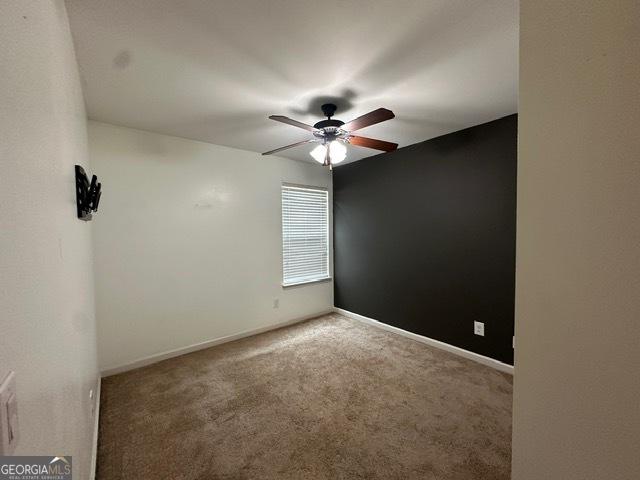 298 Timberwind Dr, Byron, GA 31008 - carpeted spare room with a ceiling fan and baseboards