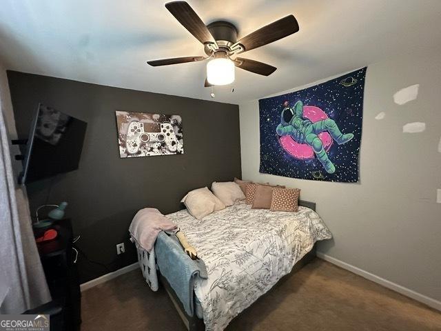 298 Timberwind Dr, Byron, GA 31008 - carpeted bedroom featuring baseboards and ceiling fan