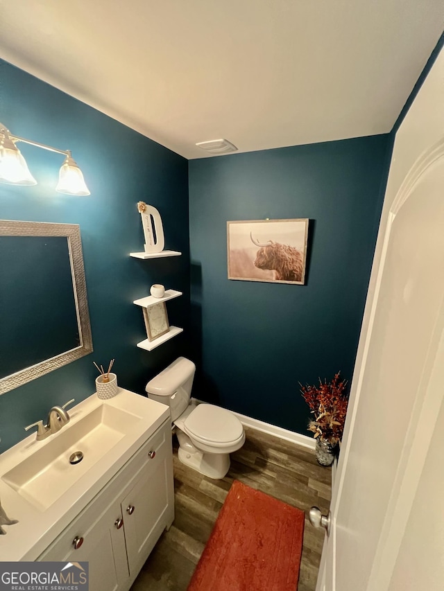 312 Indian River Dr, Jefferson, GA 30549 - half bathroom with vanity and wood finished floors