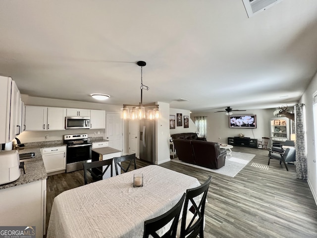 312 Indian River Dr, Jefferson, GA 30549 - dining room with dark wood-style flooring and a ceiling fan
