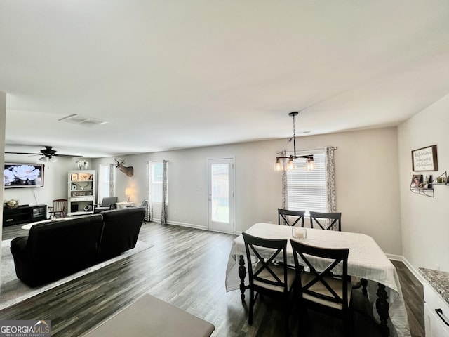 312 Indian River Dr, Jefferson, GA 30549 - dining area with dark wood-style flooring and a chandelier