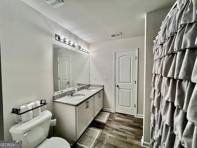312 Indian River Dr, Jefferson, GA 30549 - full bathroom featuring wood finished floors and double vanity