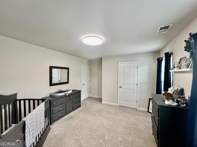 312 Indian River Dr, Jefferson, GA 30549 - bedroom with light carpet and a crib