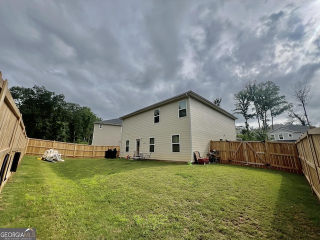 312 Indian River Dr, Jefferson, GA 30549 - rear view of house featuring a fenced backyard