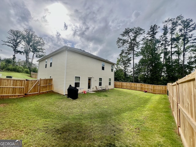 312 Indian River Dr, Jefferson, GA 30549 - back of property with a fenced backyard and a gate