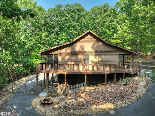 191 Deer Run Rd, Blairsville, GA 30512 - view of side of property with a wooden deck, a gate, and a view of trees