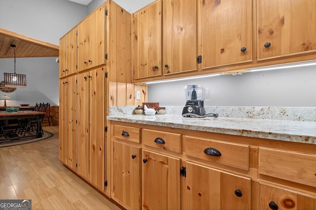 191 Deer Run Rd, Blairsville, GA 30512 - kitchen featuring light wood-type flooring, light stone countertops, decorative light fixtures, and a chandelier