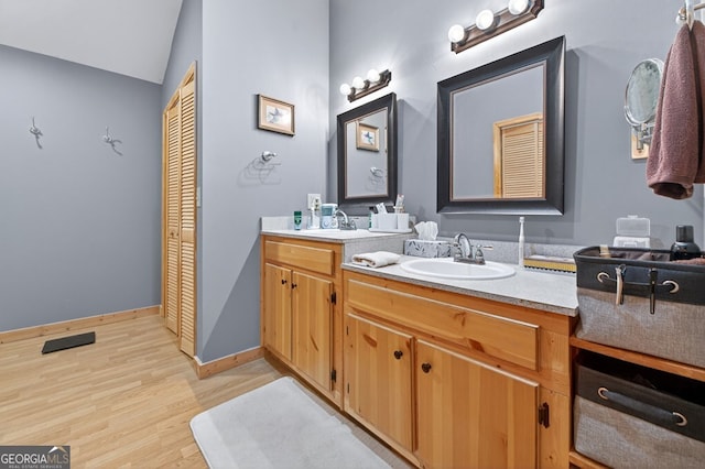 191 Deer Run Rd, Blairsville, GA 30512 - bathroom with double vanity, wood finished floors, vaulted ceiling, and a closet