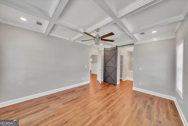 605 Live Oak Way, Dublin, GA 31021 - unfurnished bedroom with a barn door, coffered ceiling, recessed lighting, beamed ceiling, and light wood finished floors