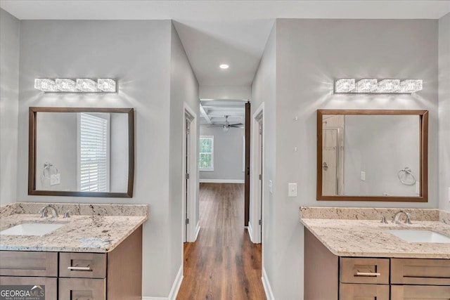 605 Live Oak Way, Dublin, GA 31021 - bathroom featuring wood finished floors, two vanities, recessed lighting, and a ceiling fan