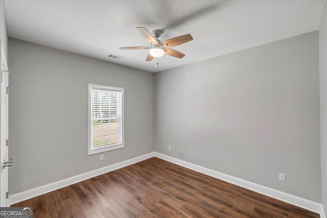 605 Live Oak Way, Dublin, GA 31021 - empty room with a ceiling fan and dark wood-type flooring