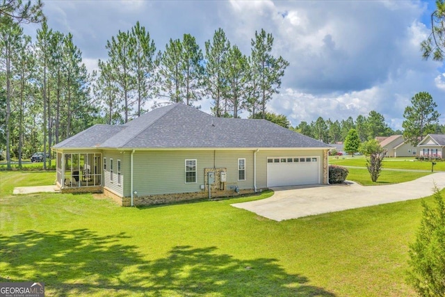 605 Live Oak Way, Dublin, GA 31021 - back of property featuring driveway, an attached garage, a lawn, and a shingled roof