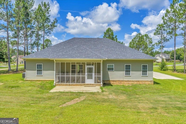 605 Live Oak Way, Dublin, GA 31021 - rear view of property featuring a sunroom, roof with shingles, and a yard