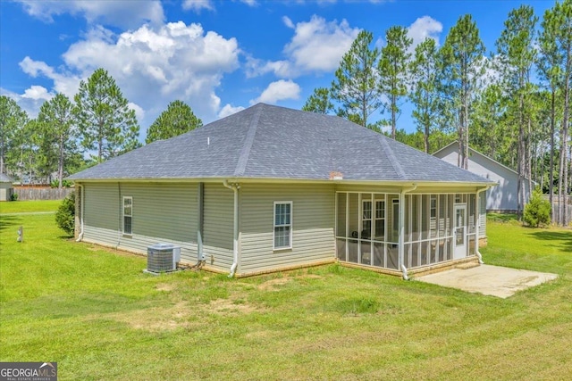 605 Live Oak Way, Dublin, GA 31021 - back of house with a sunroom, a shingled roof, and a yard