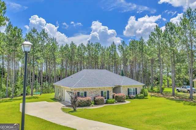 605 Live Oak Way, Dublin, GA 31021 - view of front of property featuring an attached garage, a front yard, driveway, and roof with shingles
