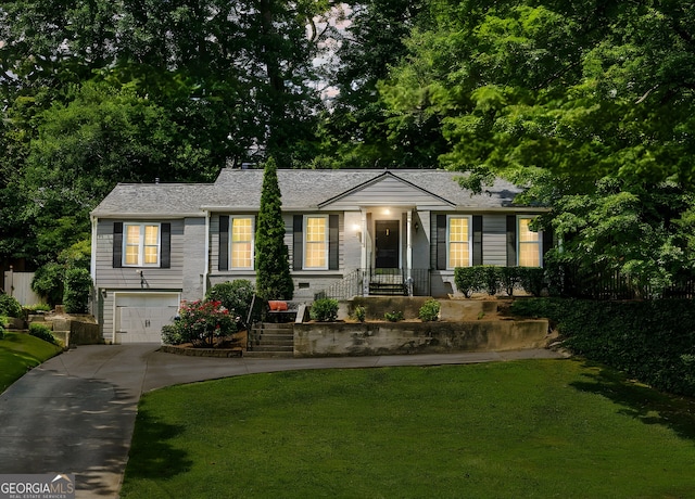 747 Channing Dr NW, Atlanta, GA 30318 - ranch-style home with concrete driveway, a garage, and a front lawn