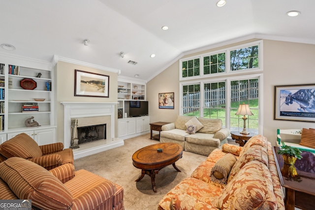 747 Channing Dr NW, Atlanta, GA 30318 - living area with vaulted ceiling, built in shelves, plenty of natural light, a high end fireplace, and light carpet