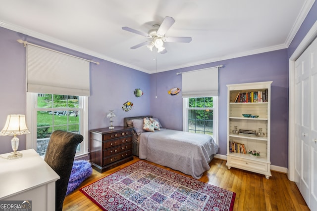 747 Channing Dr NW, Atlanta, GA 30318 - bedroom featuring hardwood / wood-style flooring, multiple windows, crown molding, and a ceiling fan