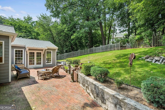 747 Channing Dr NW, Atlanta, GA 30318 - fenced backyard featuring french doors and a patio