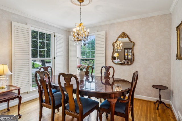 747 Channing Dr NW, Atlanta, GA 30318 - dining space featuring a chandelier, light wood-style flooring, and ornamental molding