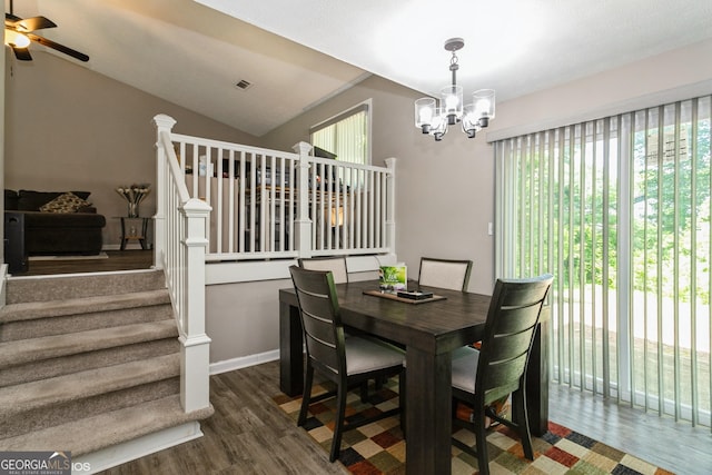 2069 Countydown Ln, Stone Mountain, GA 30088 - dining room with wood finished floors, a chandelier, ceiling fan, stairs, and lofted ceiling