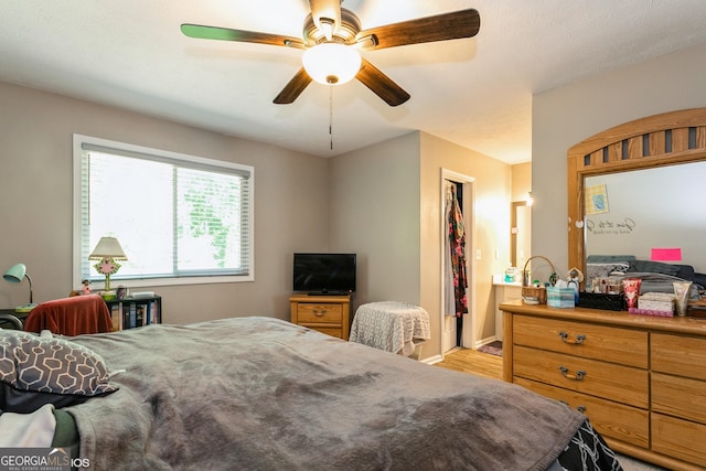 2069 Countydown Ln, Stone Mountain, GA 30088 - bedroom with light wood-style floors and ceiling fan