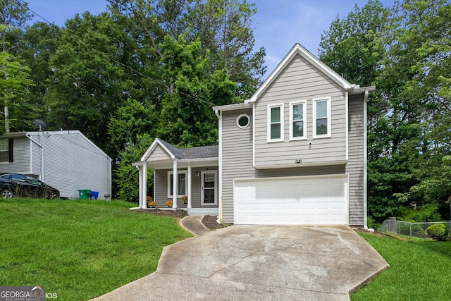 2069 Countydown Ln, Stone Mountain, GA 30088 - view of front of home featuring driveway, a garage, covered porch, and a front yard