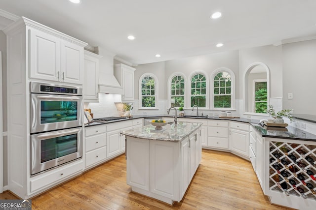 665 Greenview Ter, Milton, GA 30004 - kitchen featuring stainless steel double oven, cooktop, tasteful backsplash, recessed lighting, and white cabinets