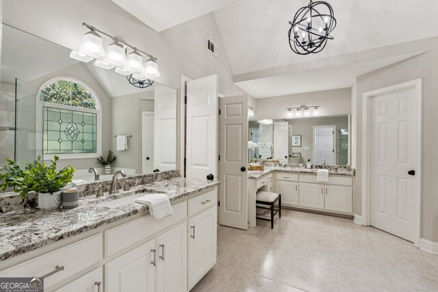665 Greenview Ter, Milton, GA 30004 - full bath with vaulted ceiling, a chandelier, tile patterned floors, two vanities, and a shower