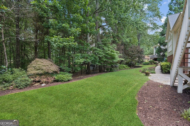 665 Greenview Ter, Milton, GA 30004 - view of grassy yard with stairway and a patio area