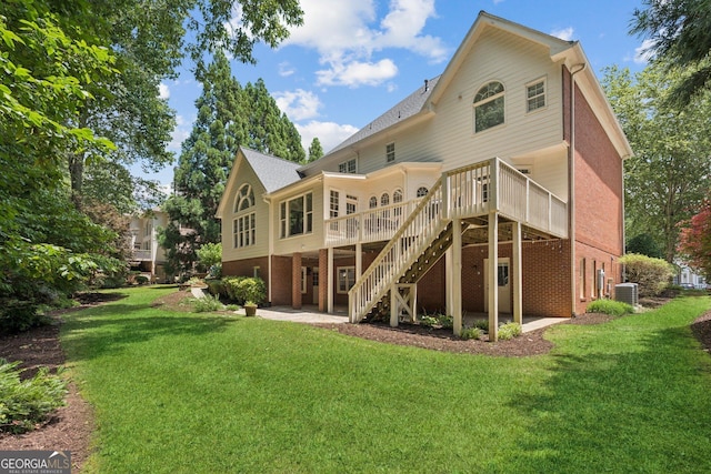 665 Greenview Ter, Milton, GA 30004 - rear view of house featuring a yard, a deck, brick siding, stairway, and a patio