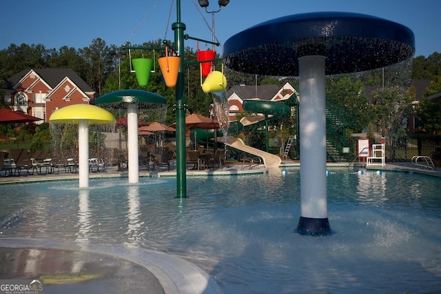 665 Greenview Ter, Milton, GA 30004 - community pool with a water slide and a water play area