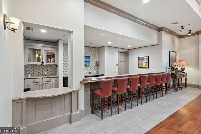 665 Greenview Ter, Milton, GA 30004 - indoor dry bar featuring crown molding, decorative backsplash, recessed lighting, and tile patterned floors