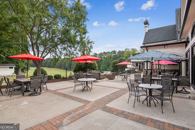 665 Greenview Ter, Milton, GA 30004 - view of patio / terrace with outdoor dining space, an outdoor hangout area, and view of wooded area