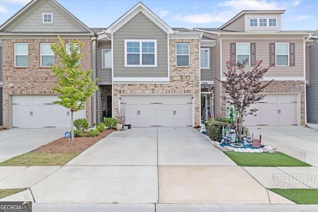 2404 Fitts Dr, Conyers, GA 30094 - townhome / multi-family property featuring driveway, an attached garage, and brick siding